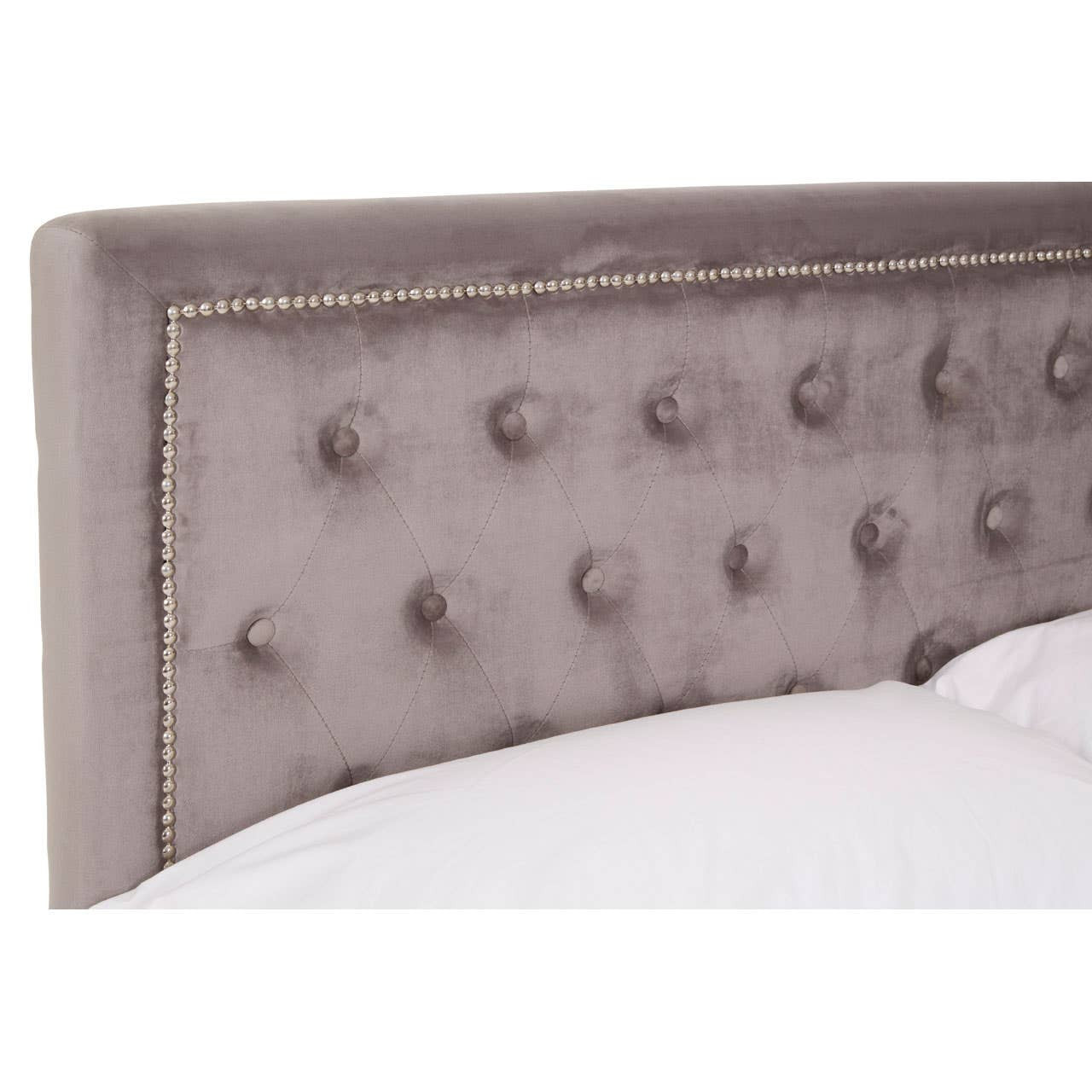 Grey velvet headboard with tufted detailing and decorative trim, designed for a double ottoman bed. The fabric has a soft sheen, enhancing the elegant look of the furniture piece