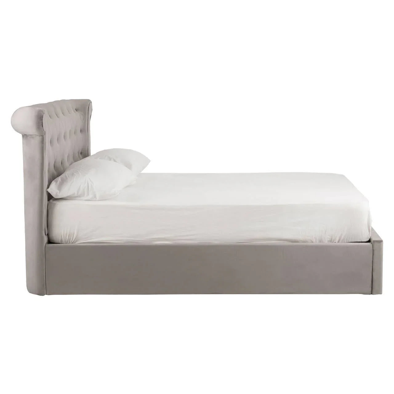 Grey upholstered bed frame with tufted wingback headboard, side view