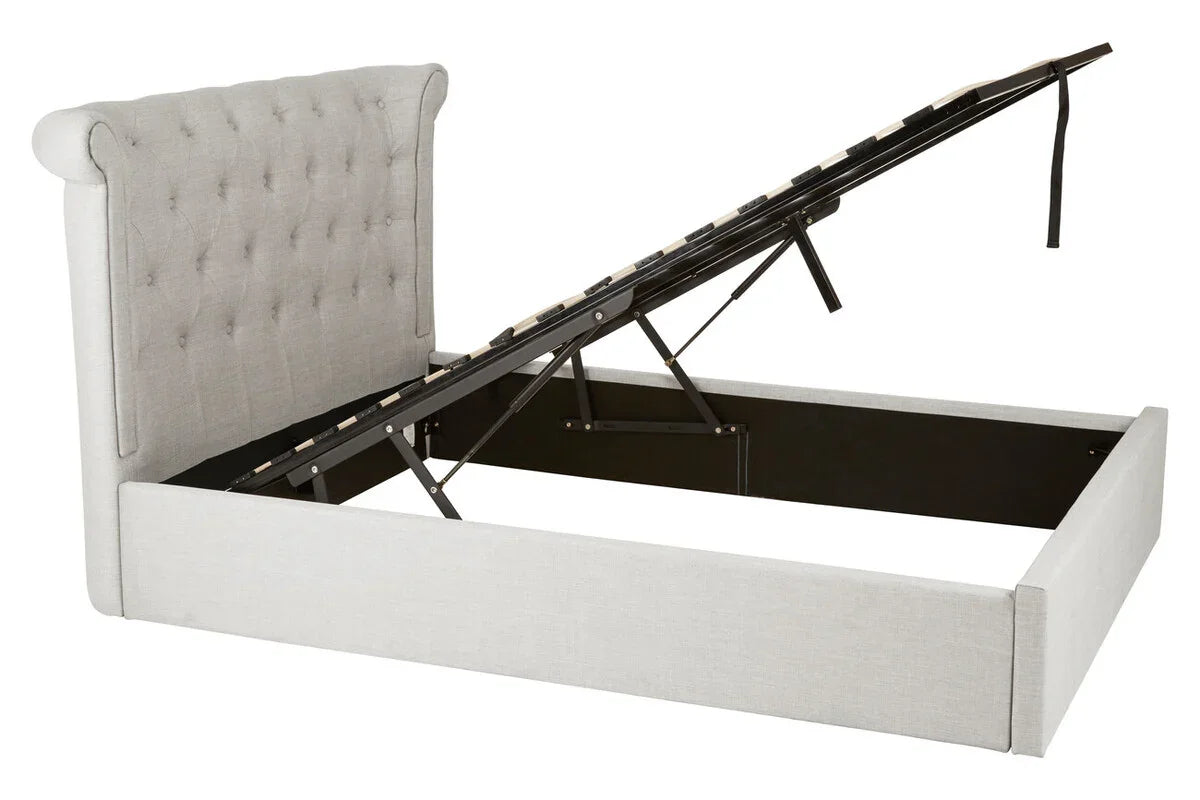 Light grey ottoman bed frame with tufted headboard and lift-up storage base