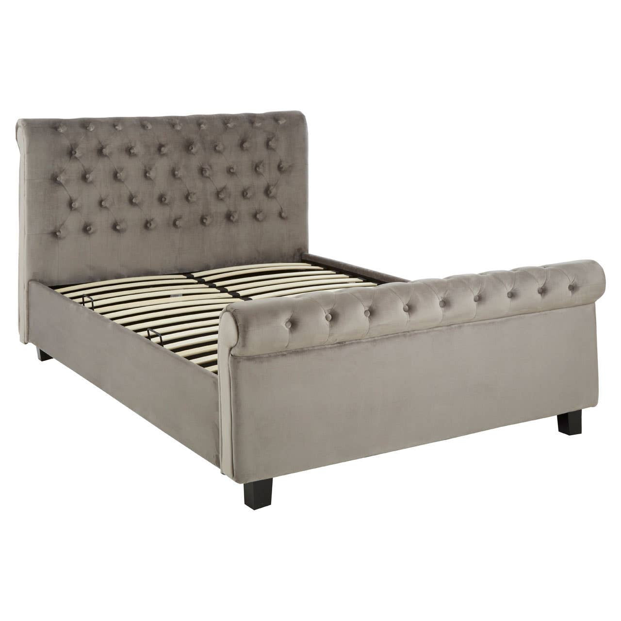 Grey upholstered king bed with a tufted headboard, decorative buttons, and a low-profile footboard. The bed features a sturdy frame with wooden slats for mattress support and black legs