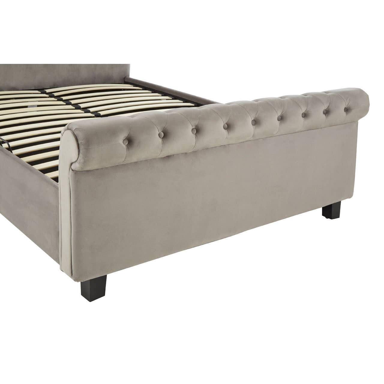 Grey upholstered king bed with a tufted headboard, decorative buttons, and wooden legs, featuring a slatted base for mattress support