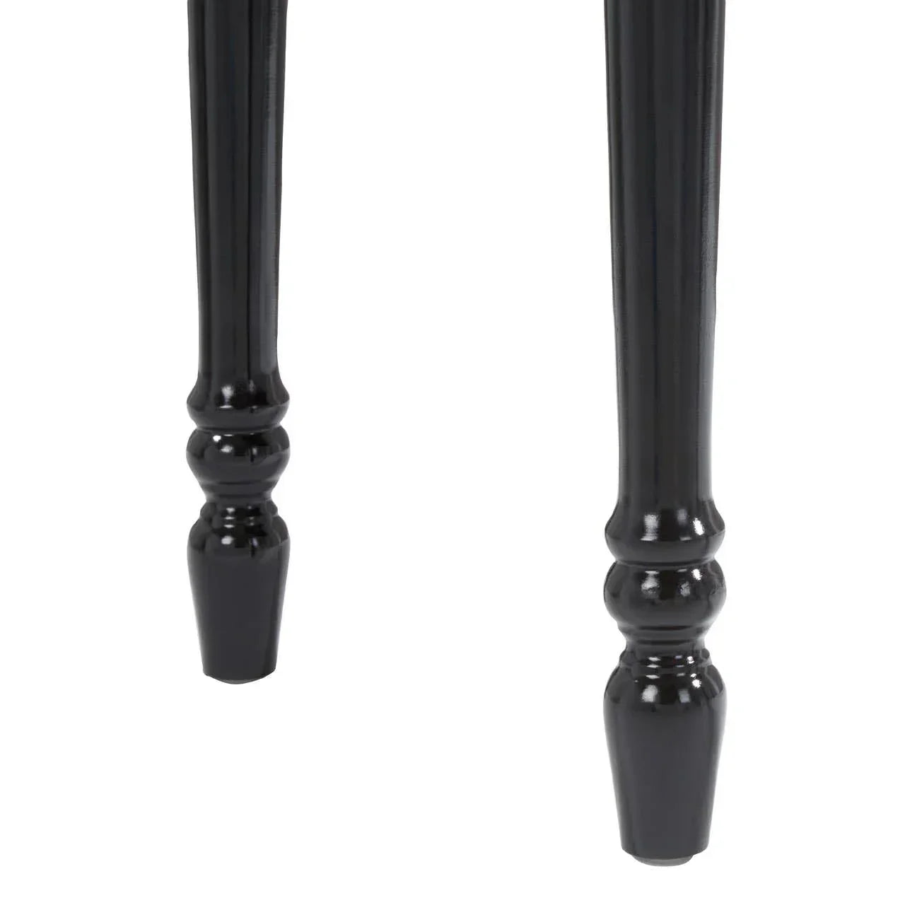 Black turned wood table legs with glossy finish, close-up view of leg detailing