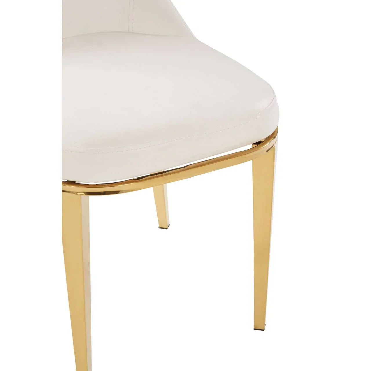 White dining chair with gold metal legs and upholstered seat, close-up view