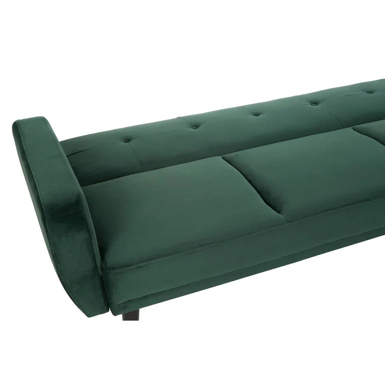Green velvet sofa bed with tufted seat and angled armrest, close-up view