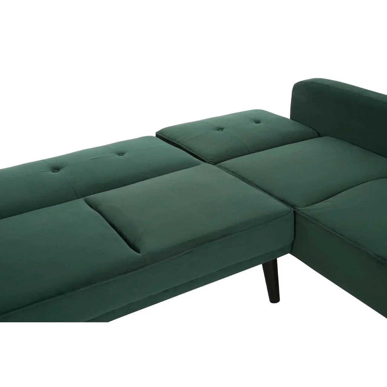 Green velvet corner sofa bed with tufted seat and dark wood legs, partial side view