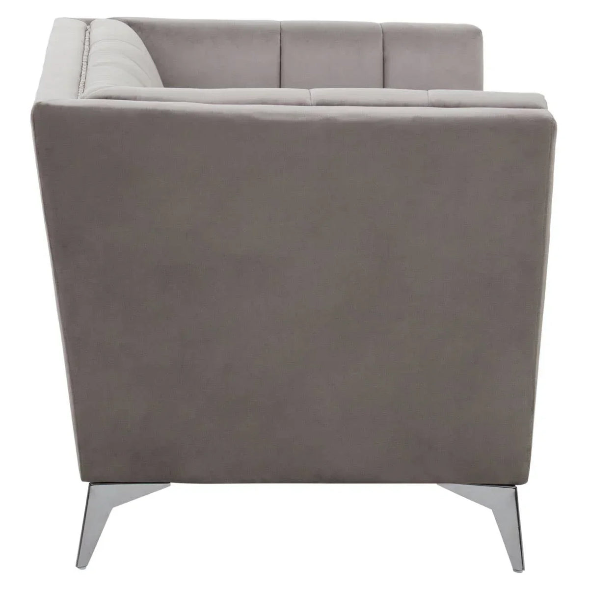 Grey velvet sofa armchair side view with chrome legs and tufted backrest