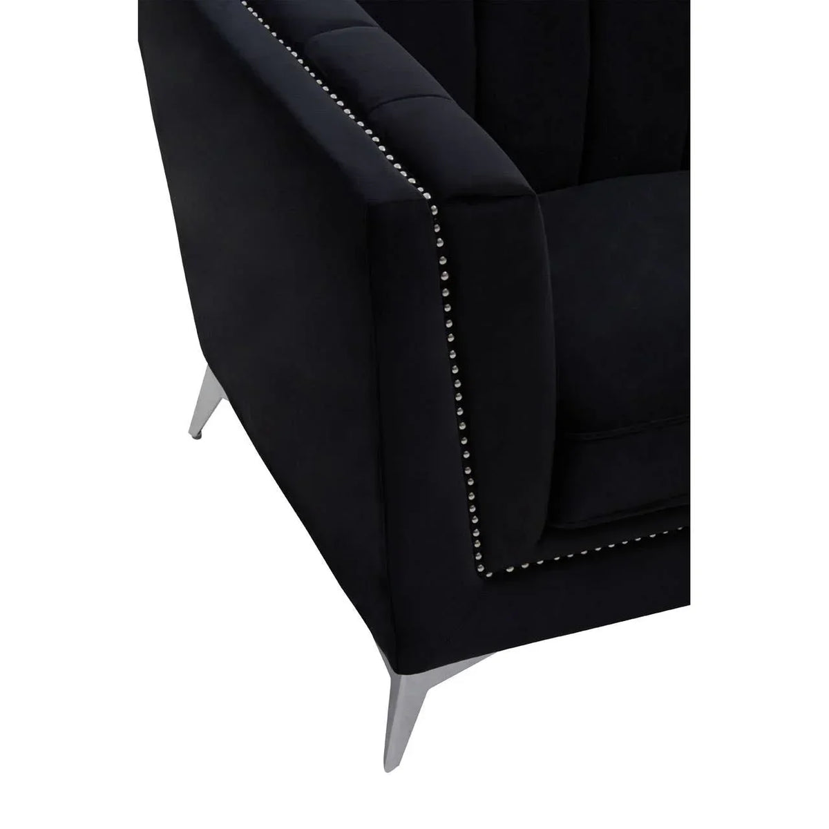 Black velvet armchair corner with metal legs and silver studded trim detail