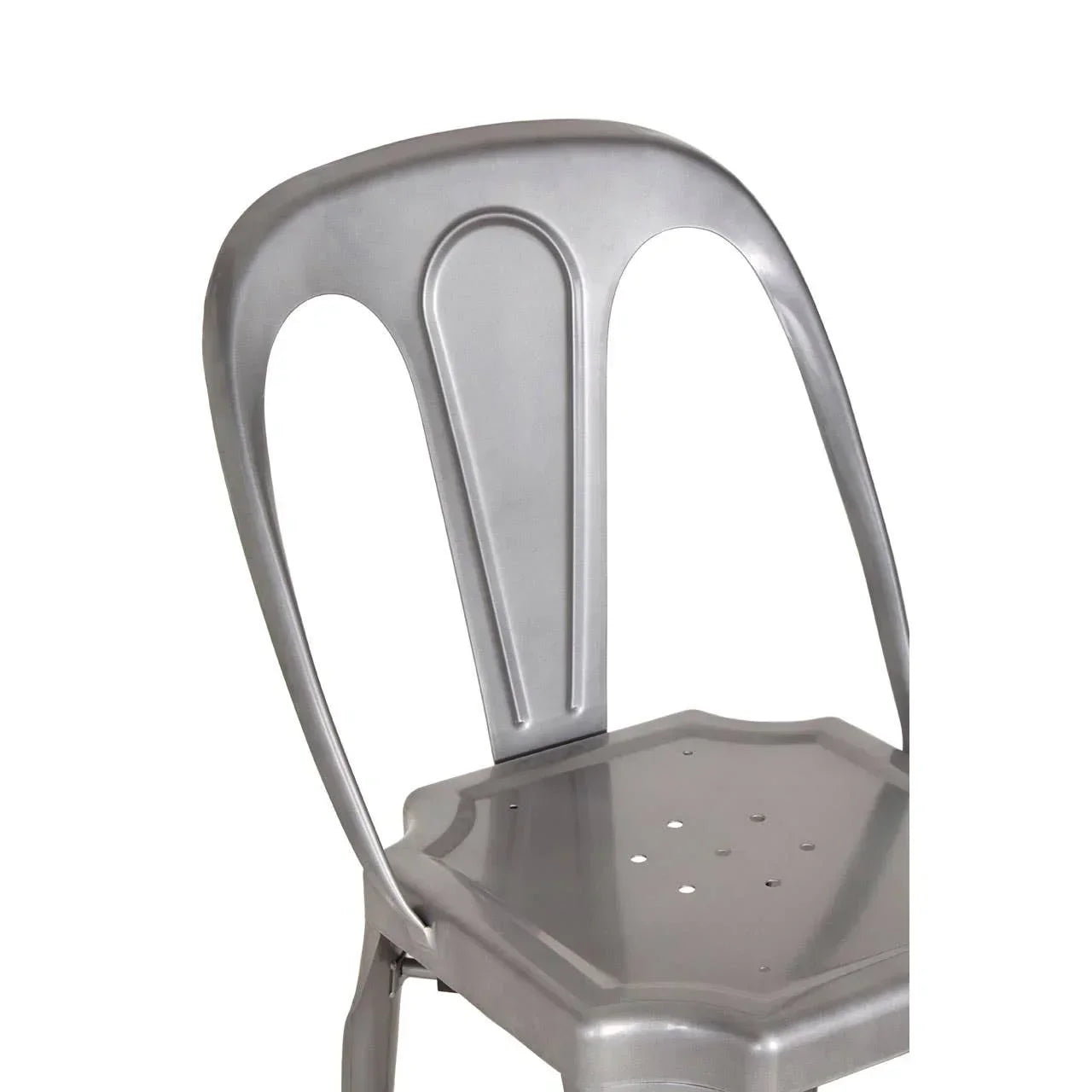 Brushed metal dining chair with curved backrest and perforated seat, partial side view