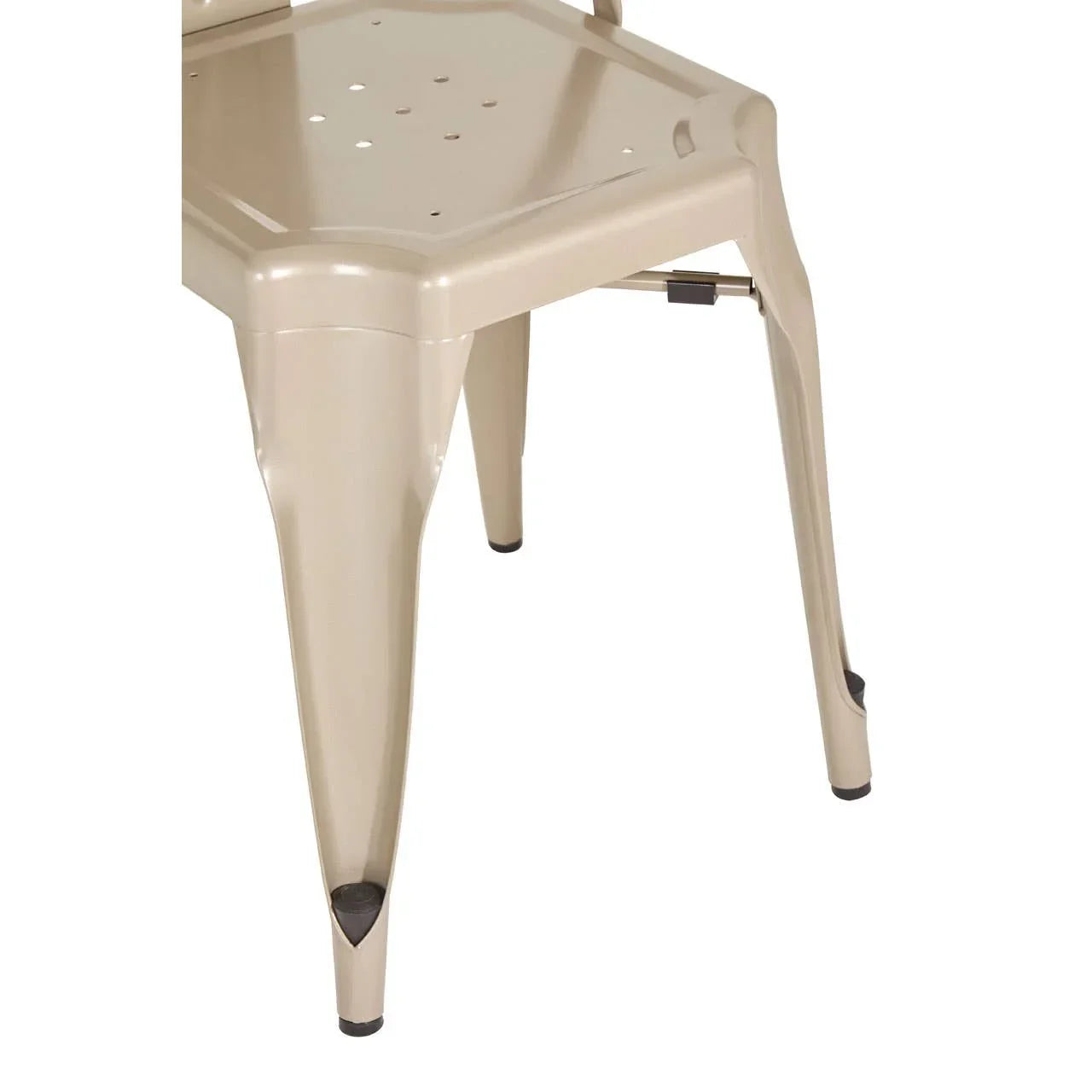 Beige metal dining chair legs and seat detail with protective foot caps