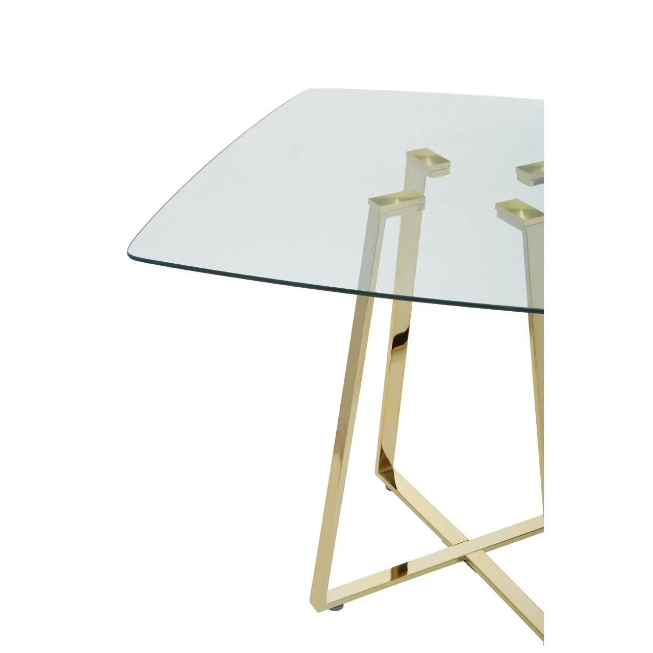 Glass dining table with gold metal frame and angled legs close up