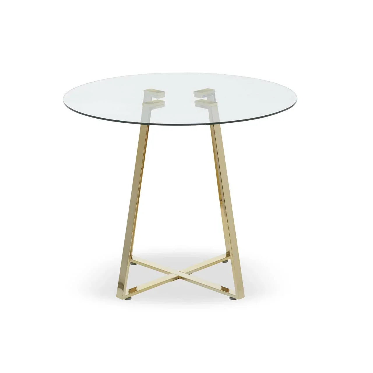 Round glass dining table with gold metal legs and cross base on white background
