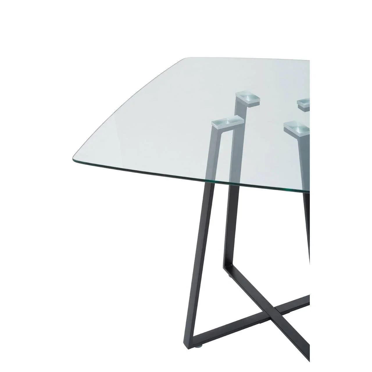 Glass dining table corner with black metal legs and modern support detail