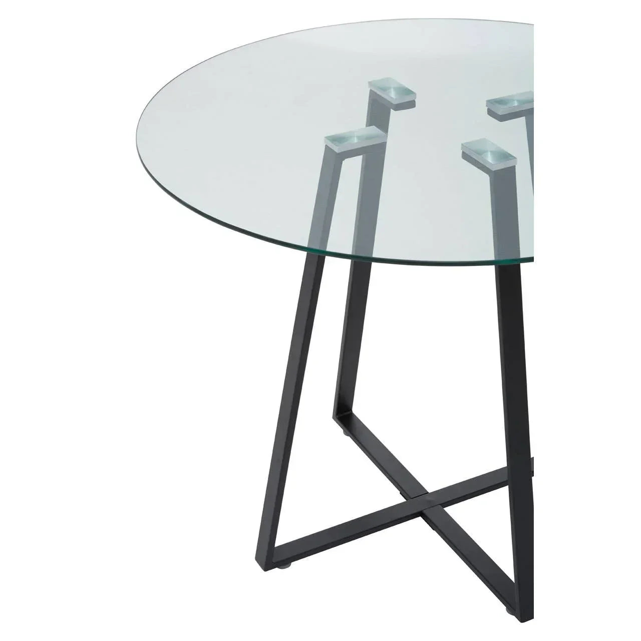 Round glass dining table with black metal legs in modern style