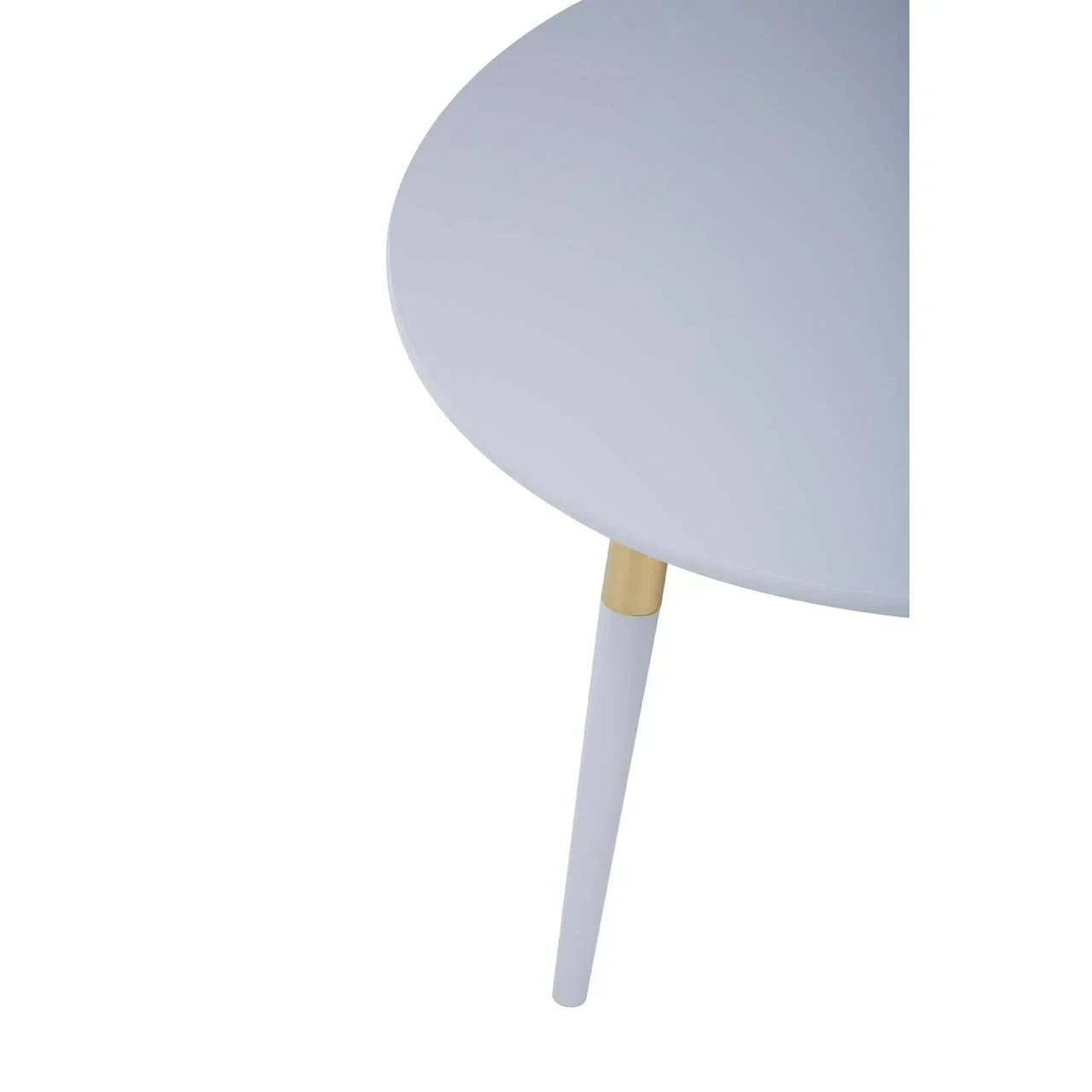 Round white dining table with tapered leg and gold accent, close-up view