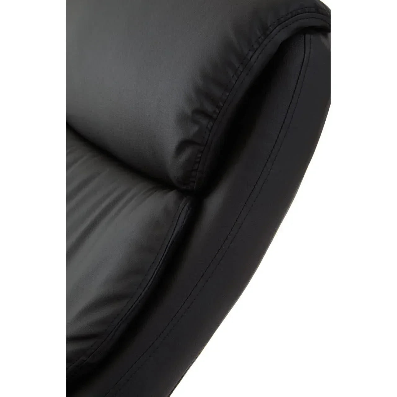 Close-up of black leather sofa cushion with stitched seam detail