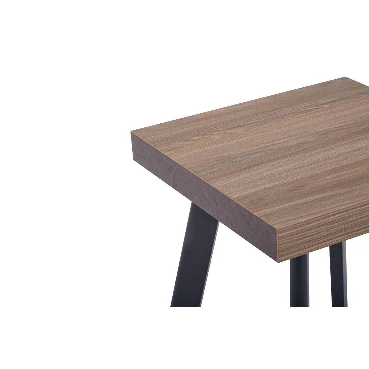 Wood effect dining table corner with black metal legs, close-up on tabletop finish