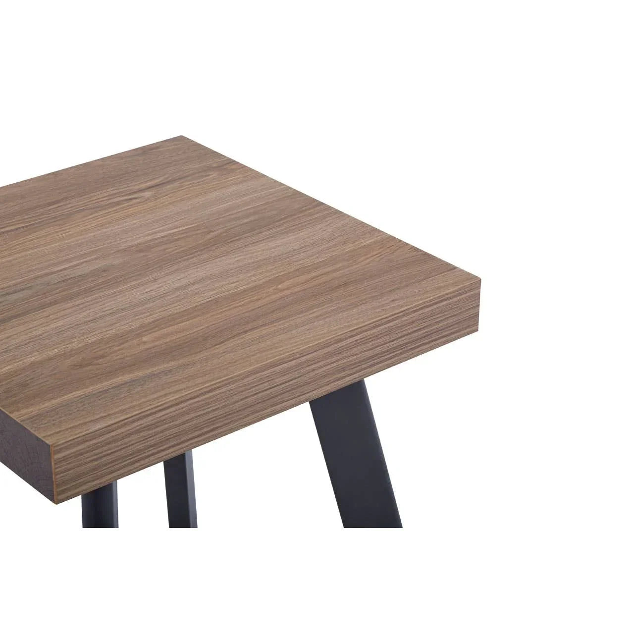 Walnut-effect dining table corner with black metal legs, close-up on tabletop texture