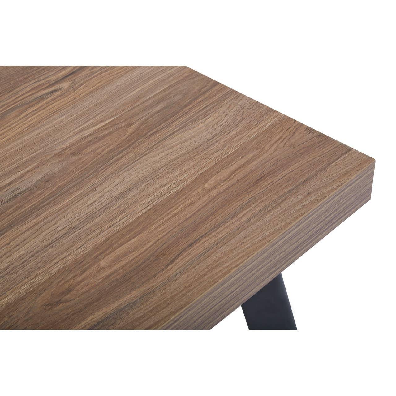 Close-up of rectangular wooden dining table top with natural grain and black metal leg