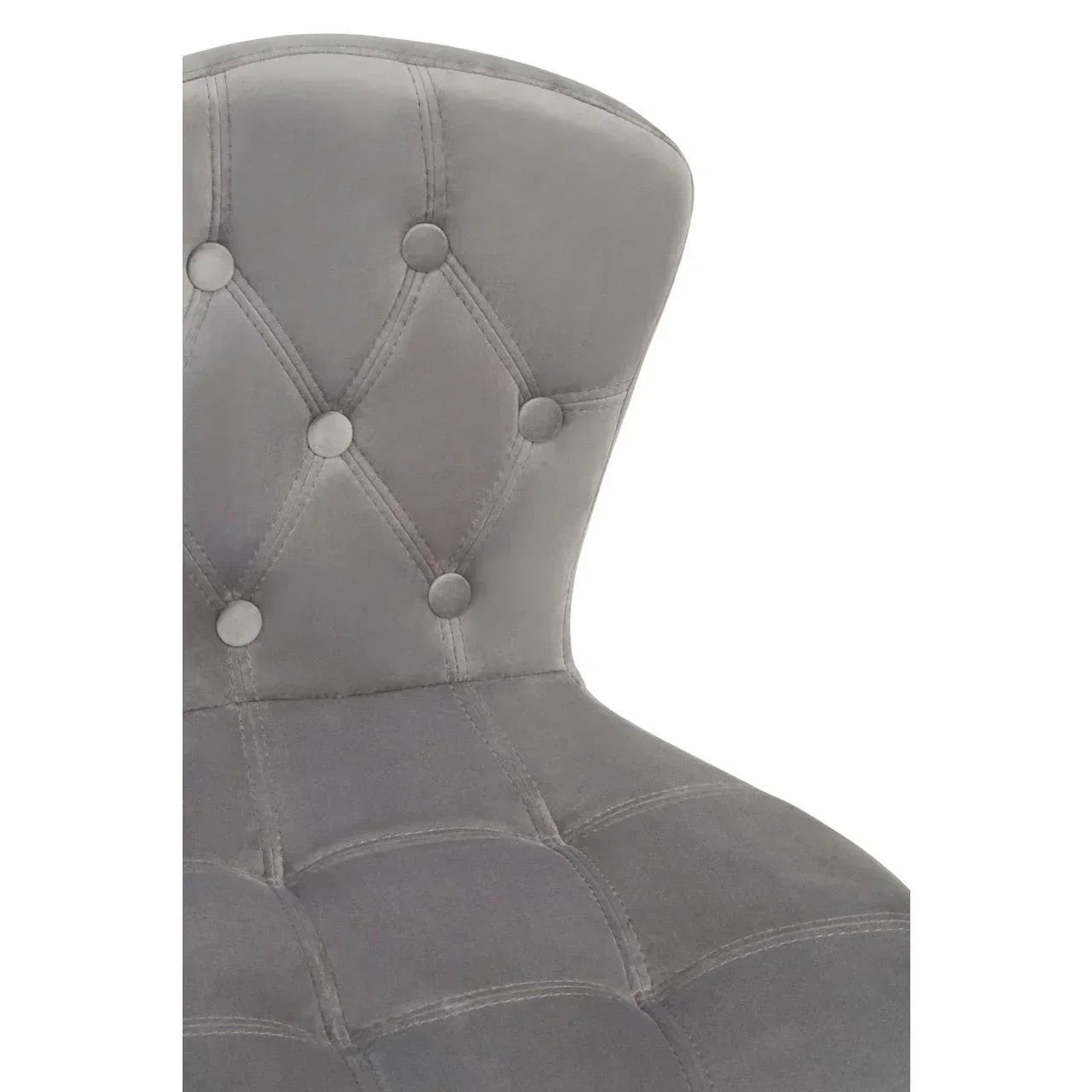 Grey velvet dining chair with tufted button backrest, close-up view