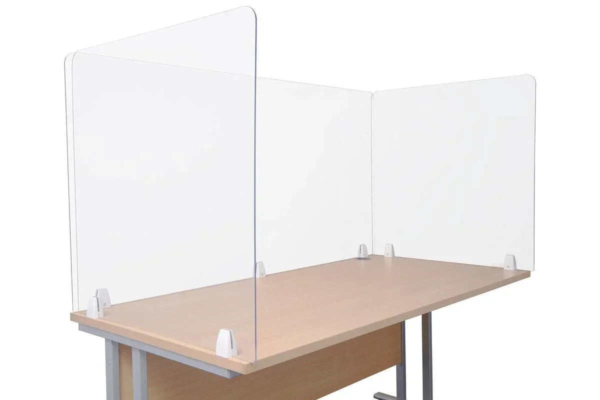 Clear acrylic desk screen with three panels mounted on a light wood office table