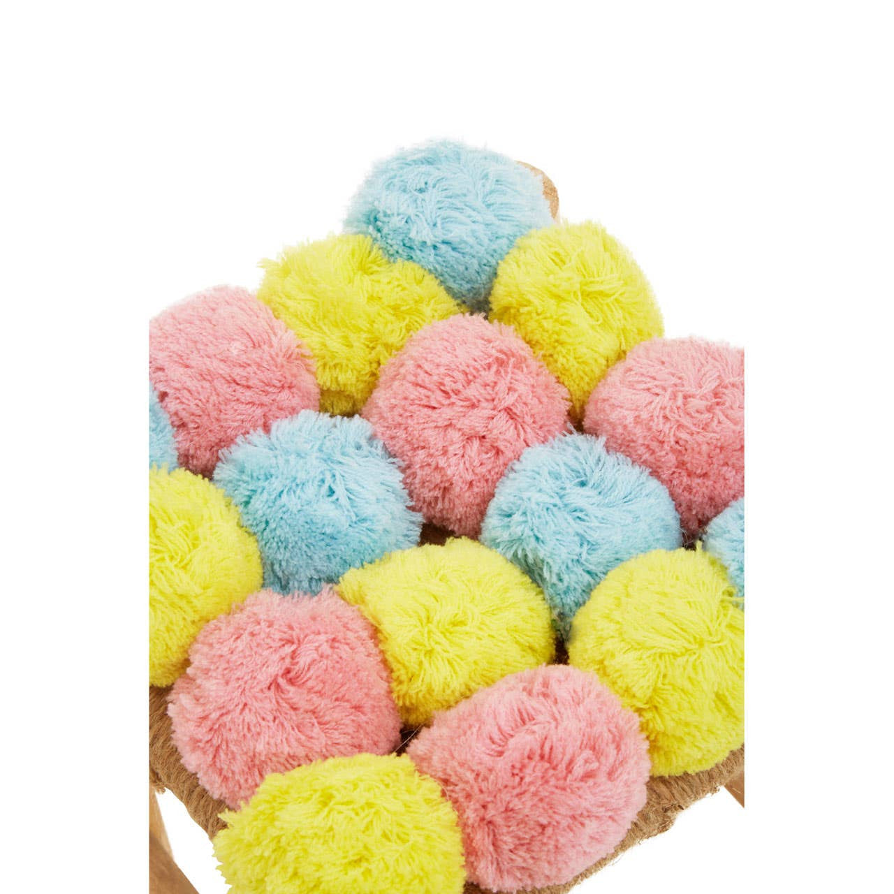 A colorful stool featuring a playful arrangement of pink, blue, and yellow pom poms on a neutral base, adding a whimsical touch to home decor