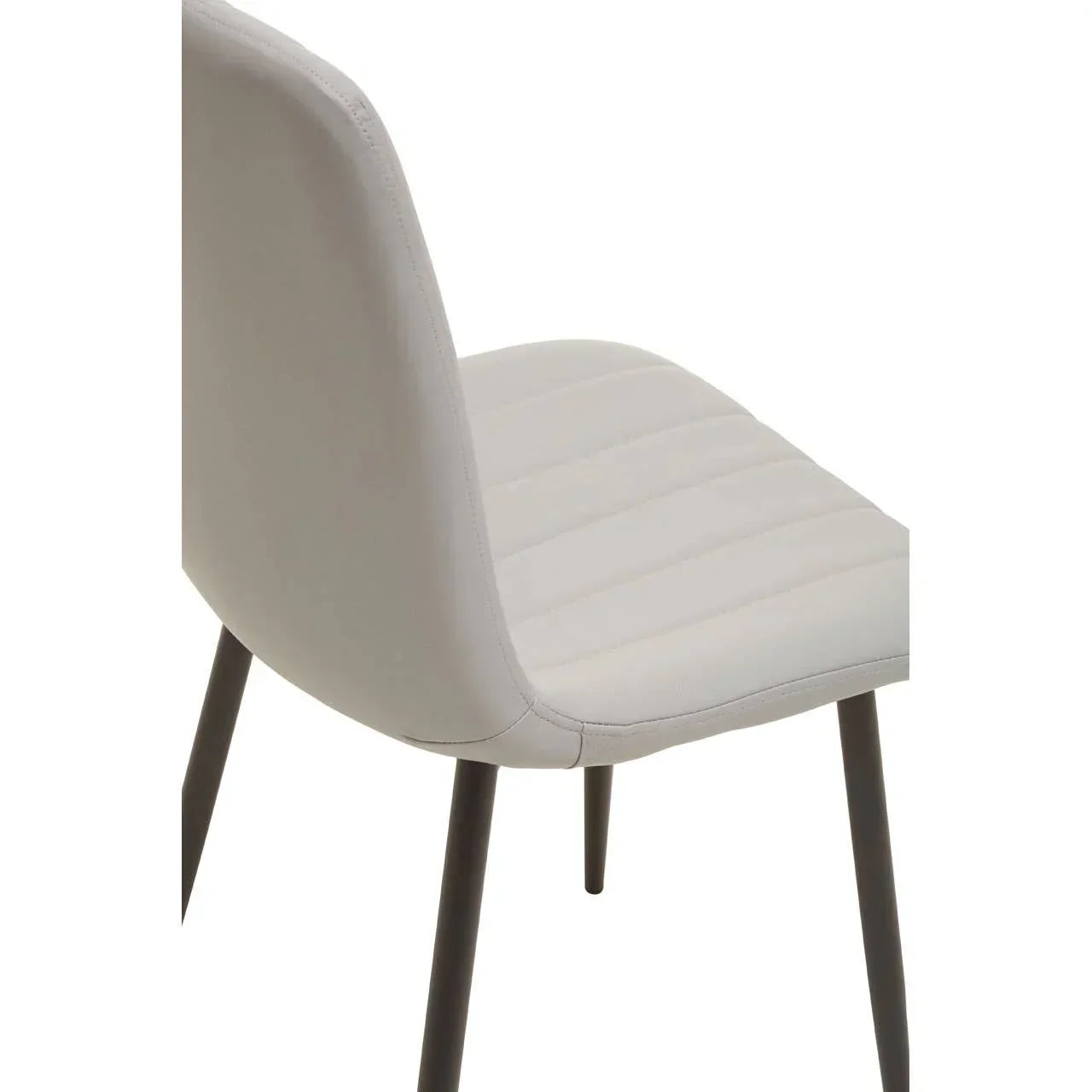 Closeup of grey dining chair with black metal legs and textured upholstered seat