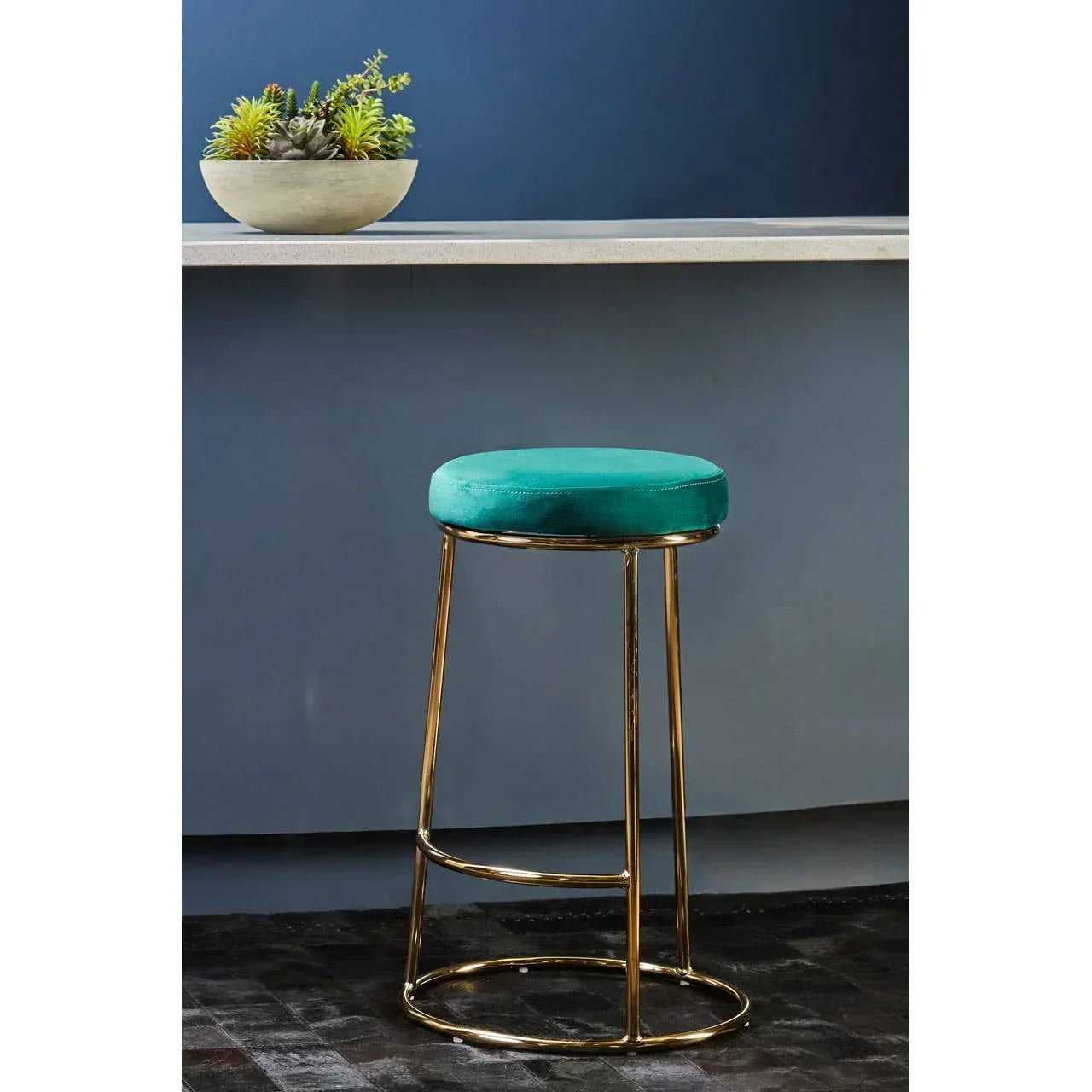 Velvet bar stool with gold metal legs and teal seat at modern kitchen counter