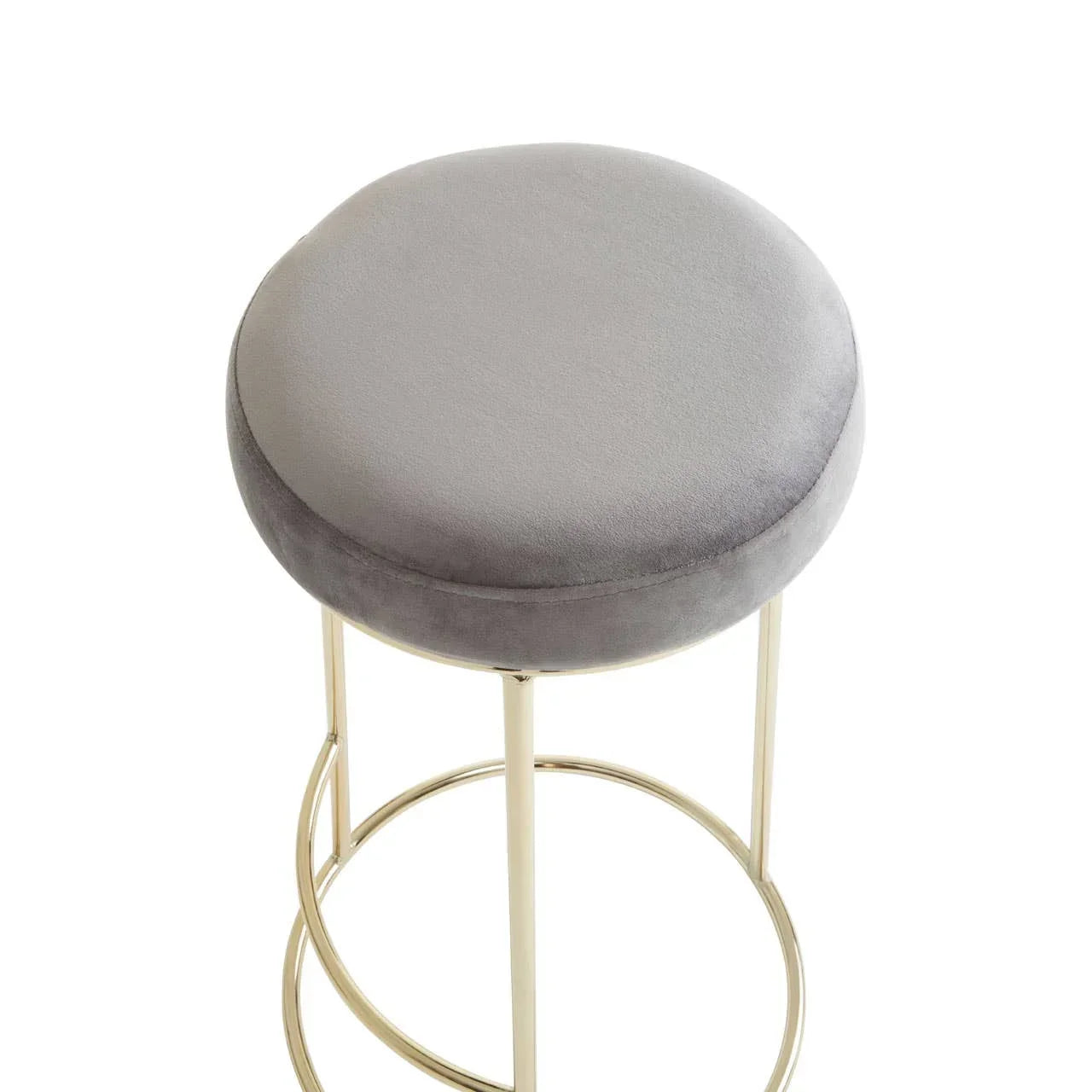 Grey velvet bar stool with gold metal legs and circular footrest, top angle view