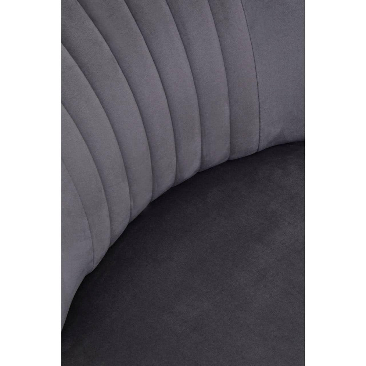 Closeup of grey velvet sofa upholstery with vertical channel stitching