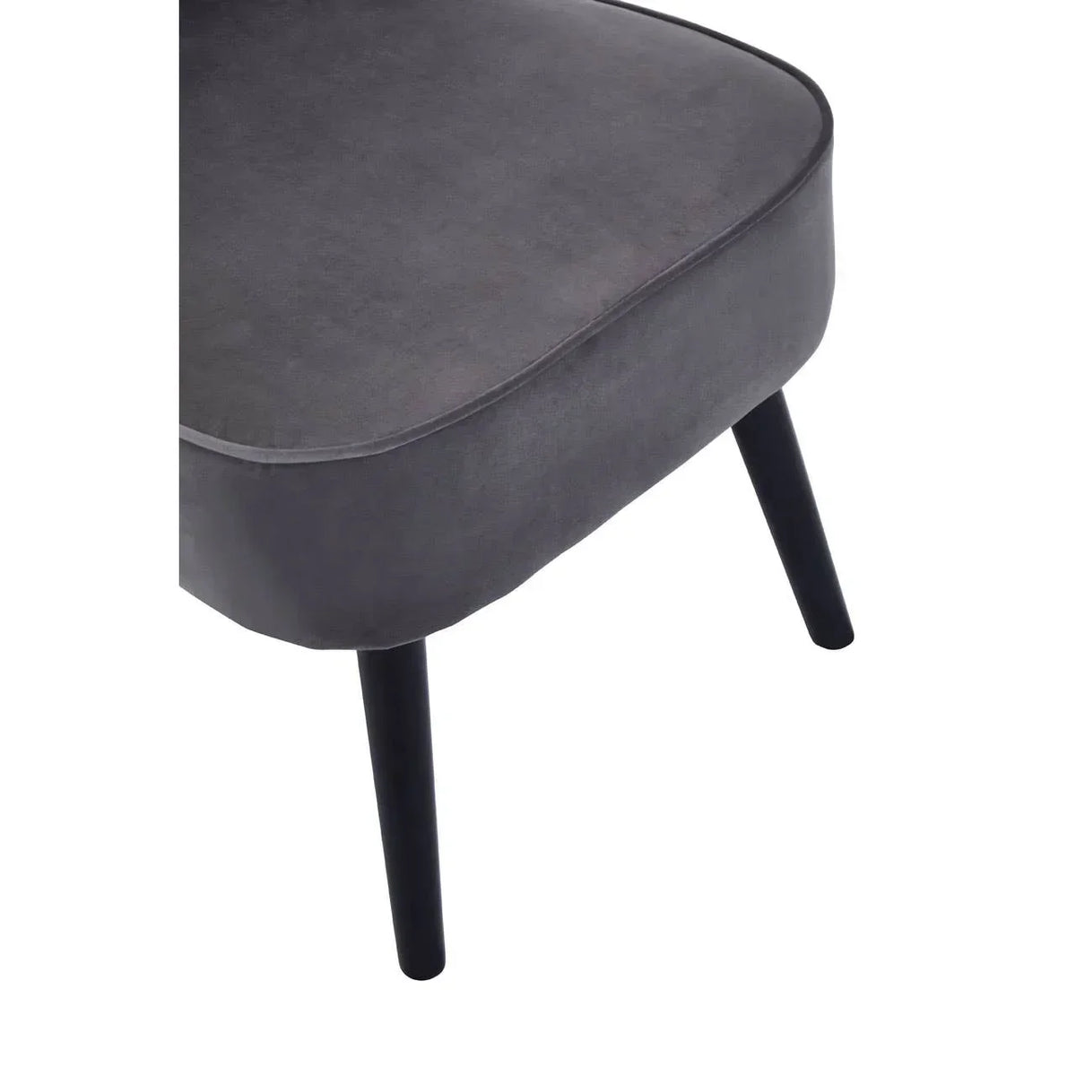 Close view of dark grey fabric chair seat with black angled wooden legs