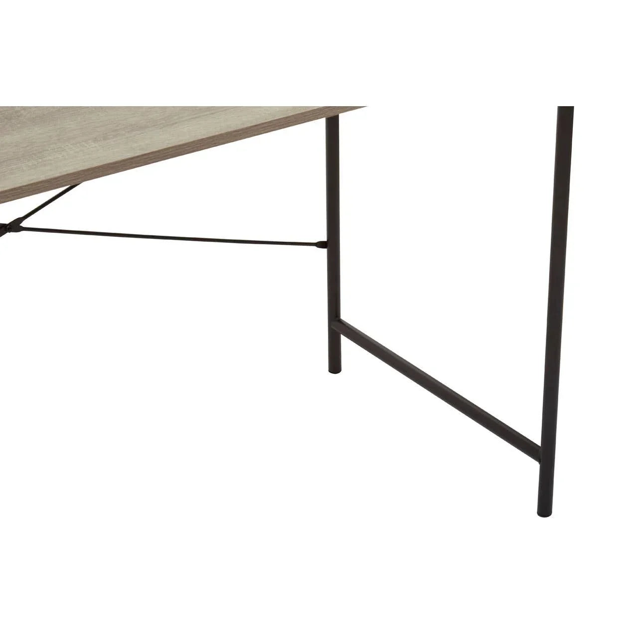Closeup of dining table legs with black metal frame and light wood tabletop