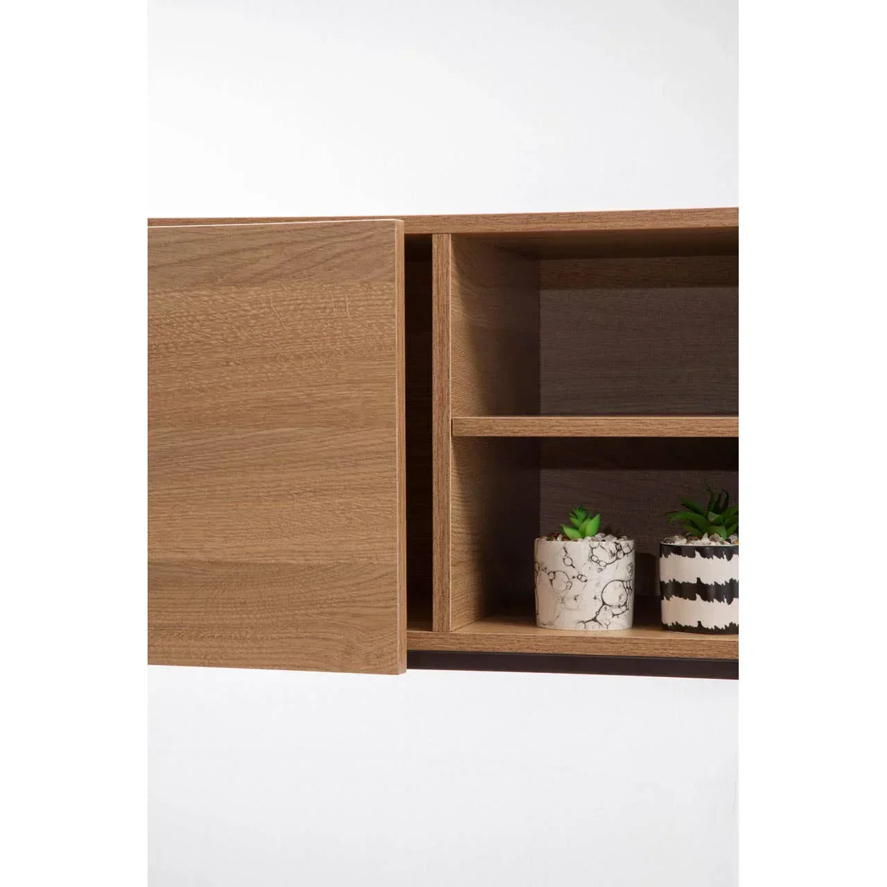 Oak wall cabinet with open shelving and two small potted plants on lower shelf