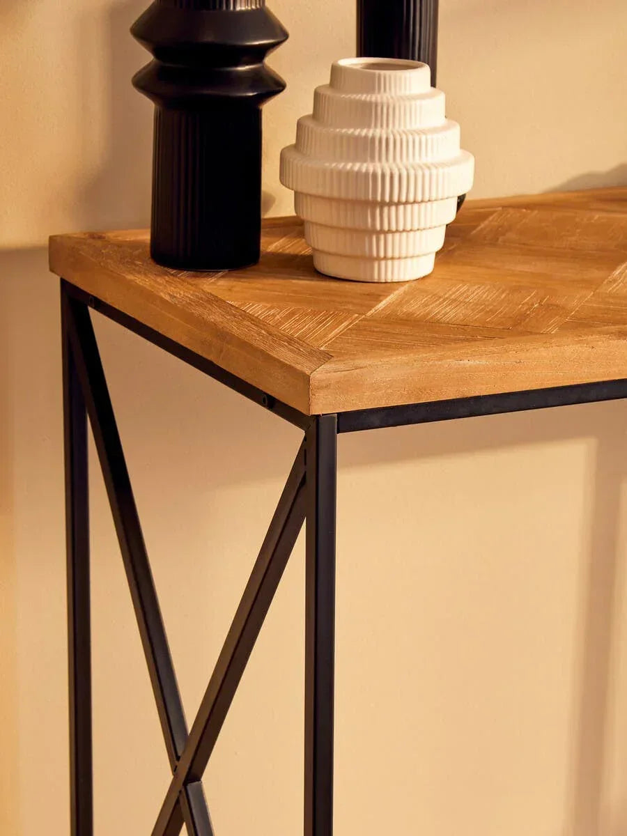 Wood and metal console table with decorative black and white vases