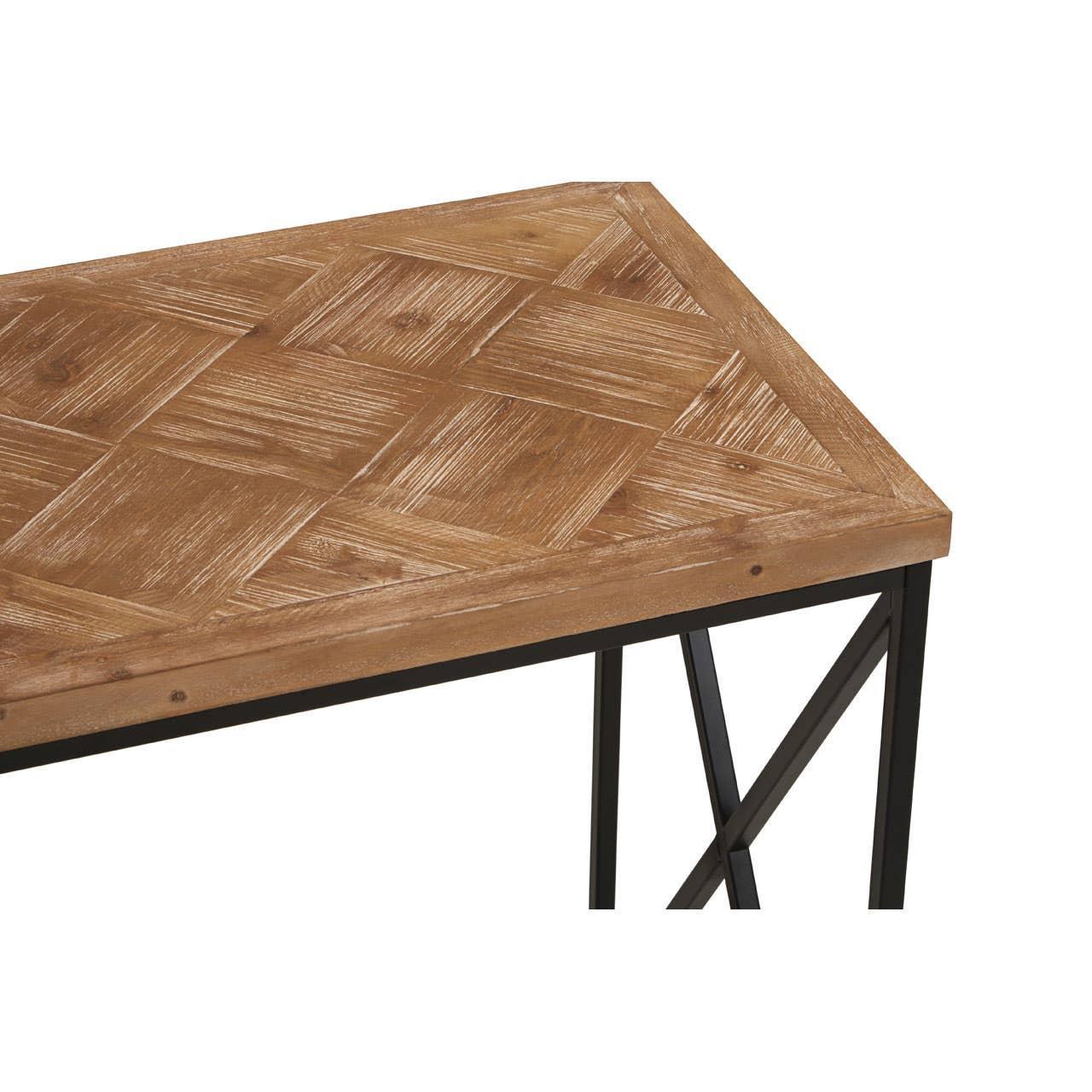 Wooden dining table with geometric parquet top and black metal frame, corner angle view