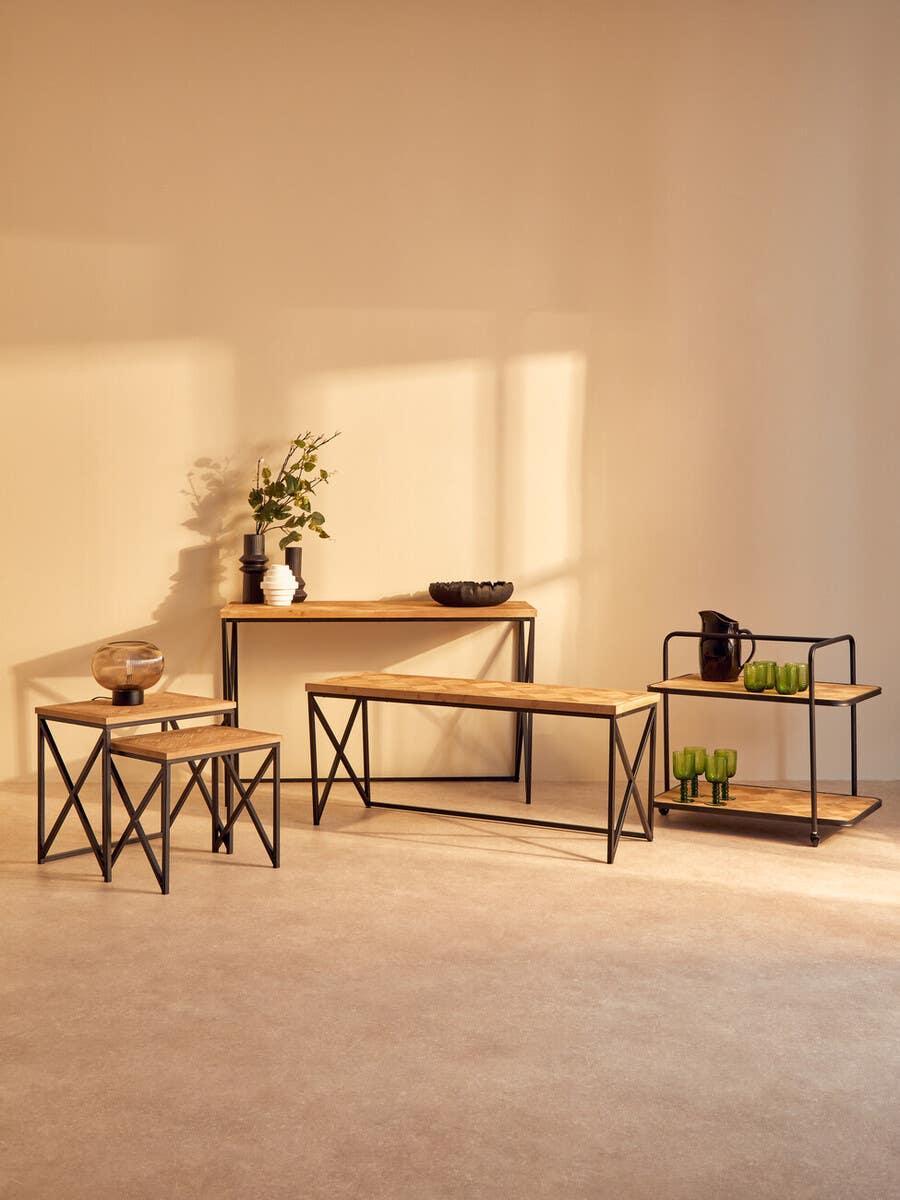 Industrial style furniture set with oak wood tops and black metal frames in living room