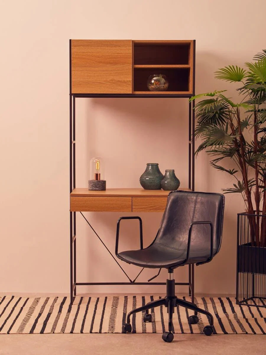 Modern home office desk with oak shelves and black swivel chair on striped rug