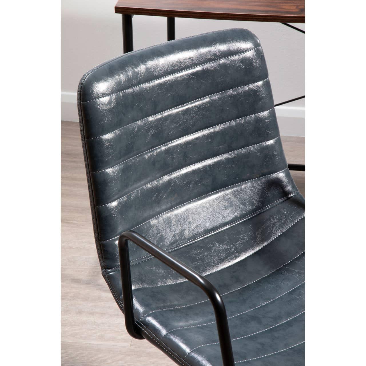 Grey faux leather dining chair with stitched seat and black metal armrest
