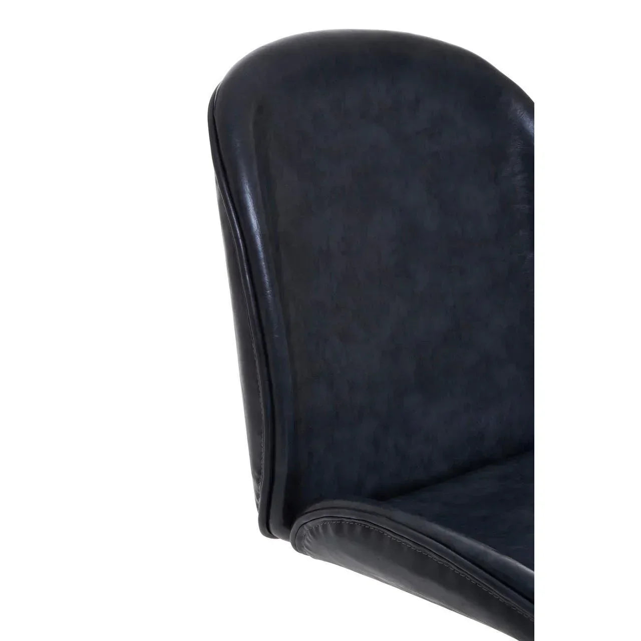 Black faux leather dining chair backrest close-up