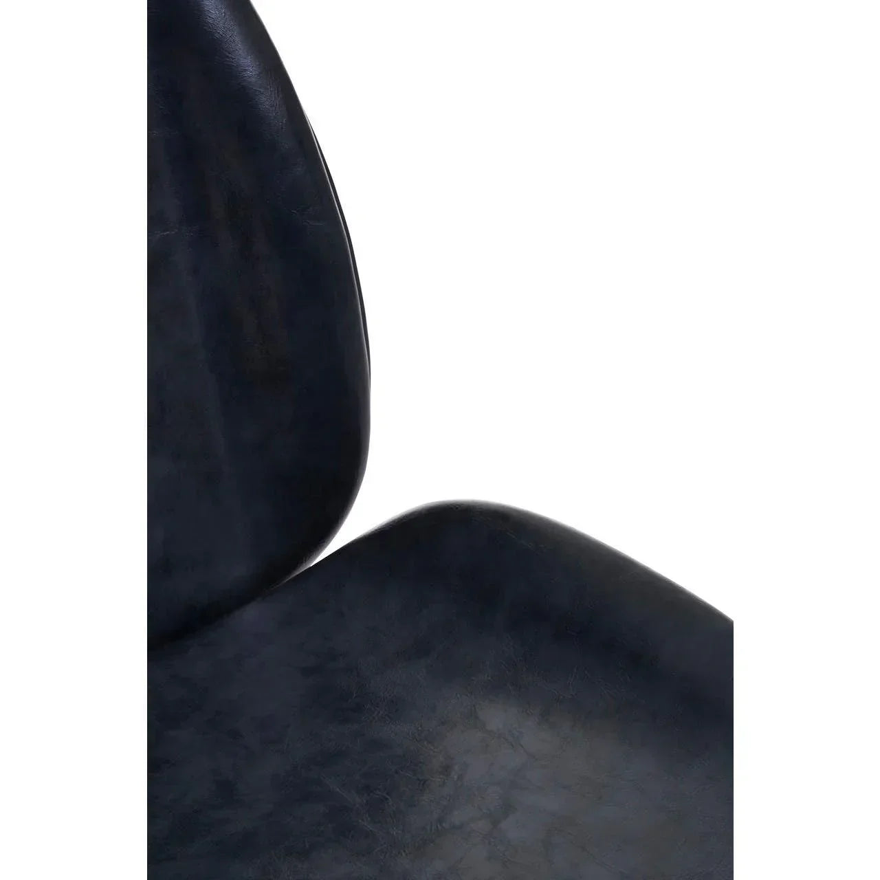 Close detail of curved black faux leather dining chair seat and backrest