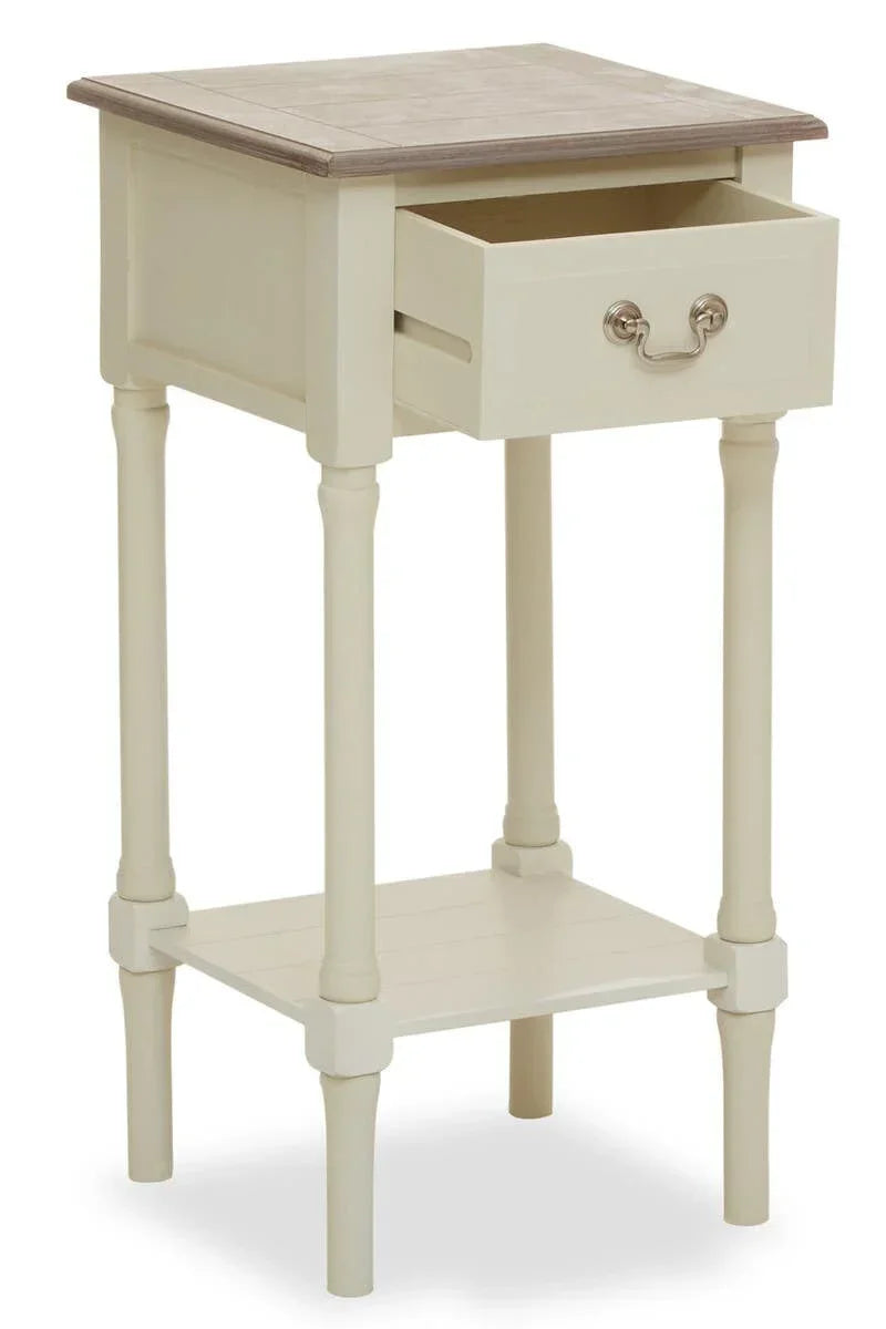 Cream wooden bedside table with open drawer, lower shelf, and light oak top