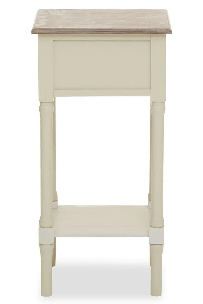 Cream wooden side table with light oak top, lower shelf, and turned legs, front view