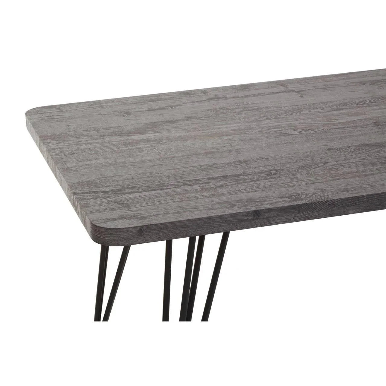 Rectangular wooden dining table with dark metal hairpin legs, close view of tabletop