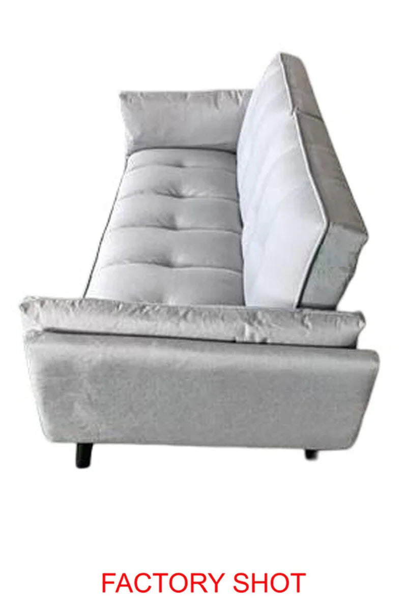 side view of light grey fabric sofa with button-tufted seat and low legs