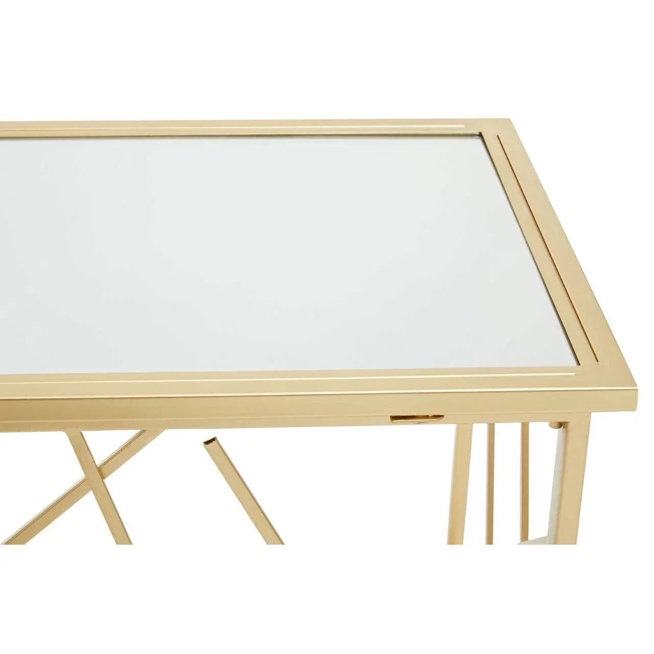 Rectangular glass top coffee table with gold finished metal frame and geometric legs detail