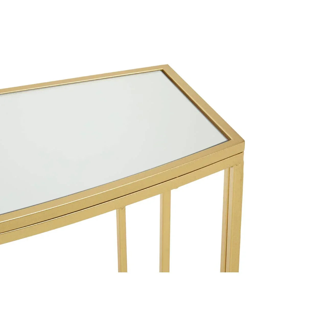 Gold console table with glass top and metal frame, close-up of corner detail