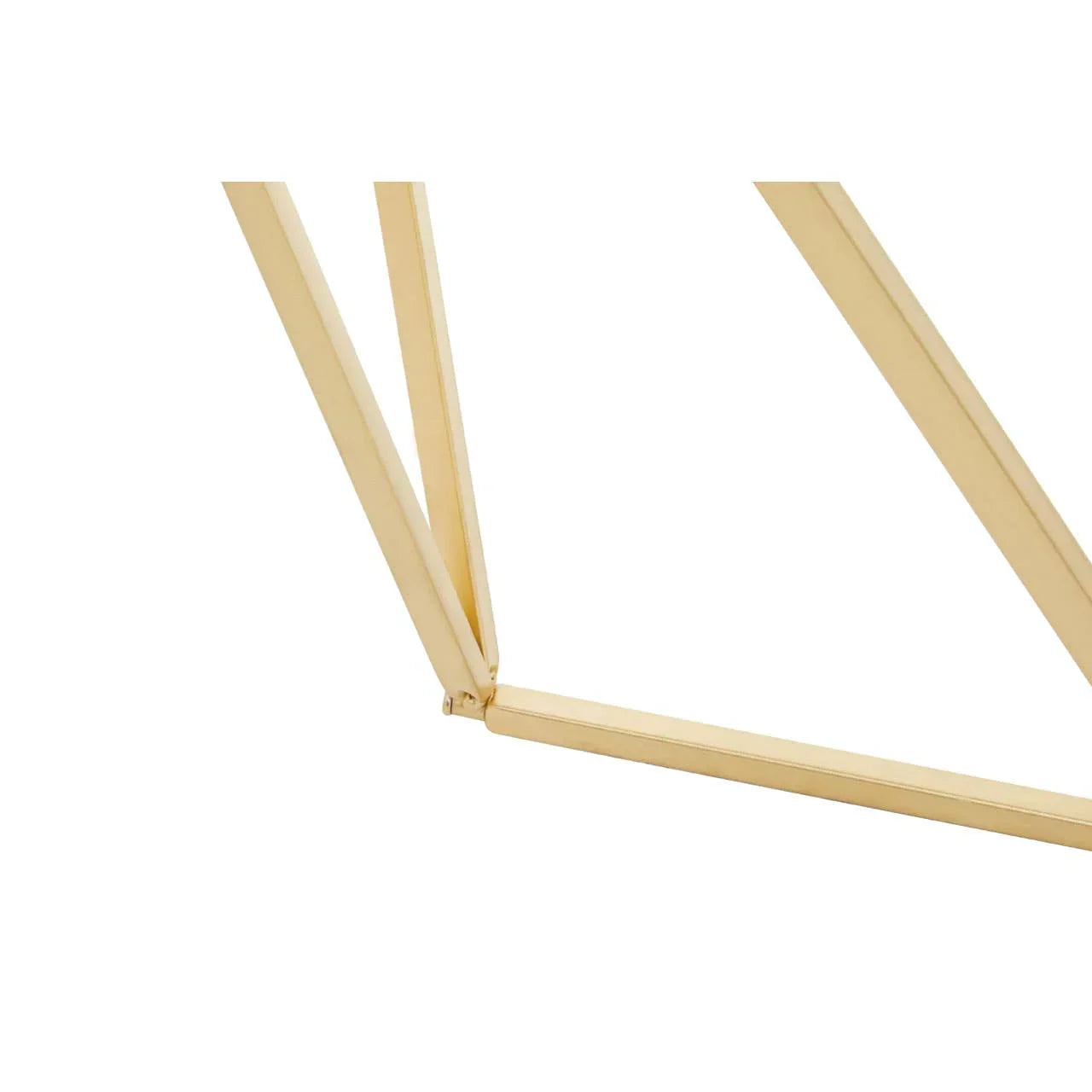 Gold metal table leg with modern geometric design, close-up on join and finish