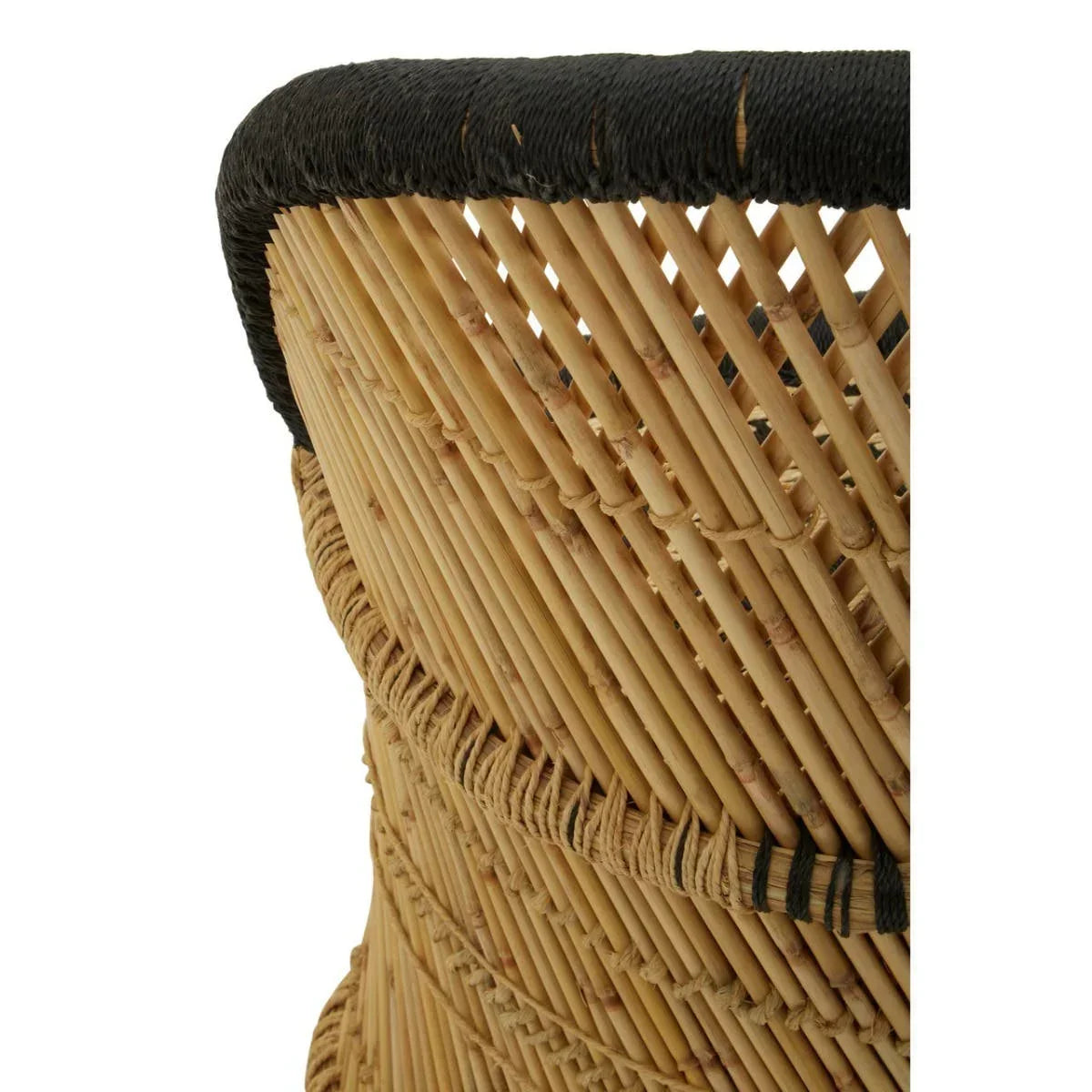 Closeup of natural rattan chair back with woven black edge detail