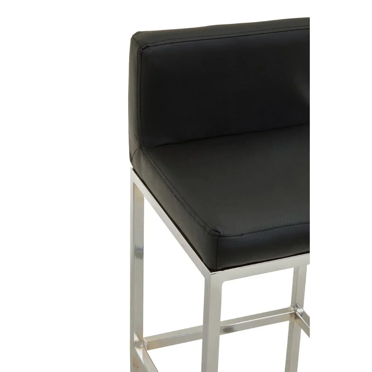 Black faux leather bar stool with chrome metal legs and low backrest, side angle view