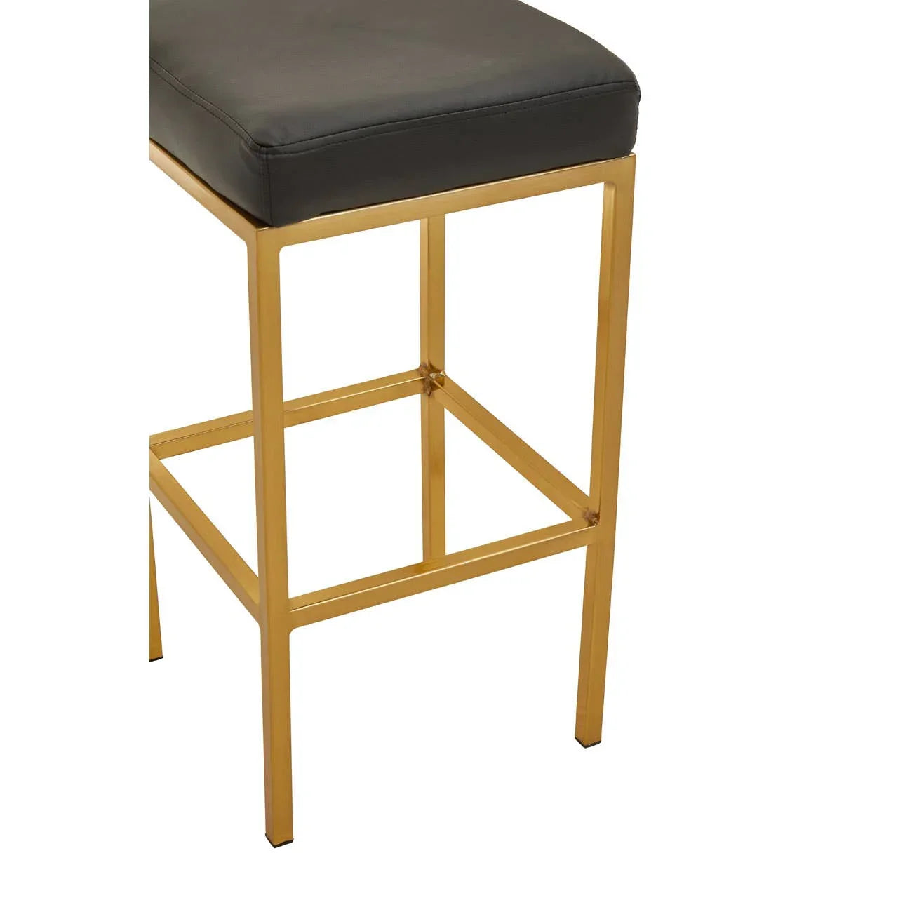 Bar stool with gold metal frame and black cushioned seat, side angle view