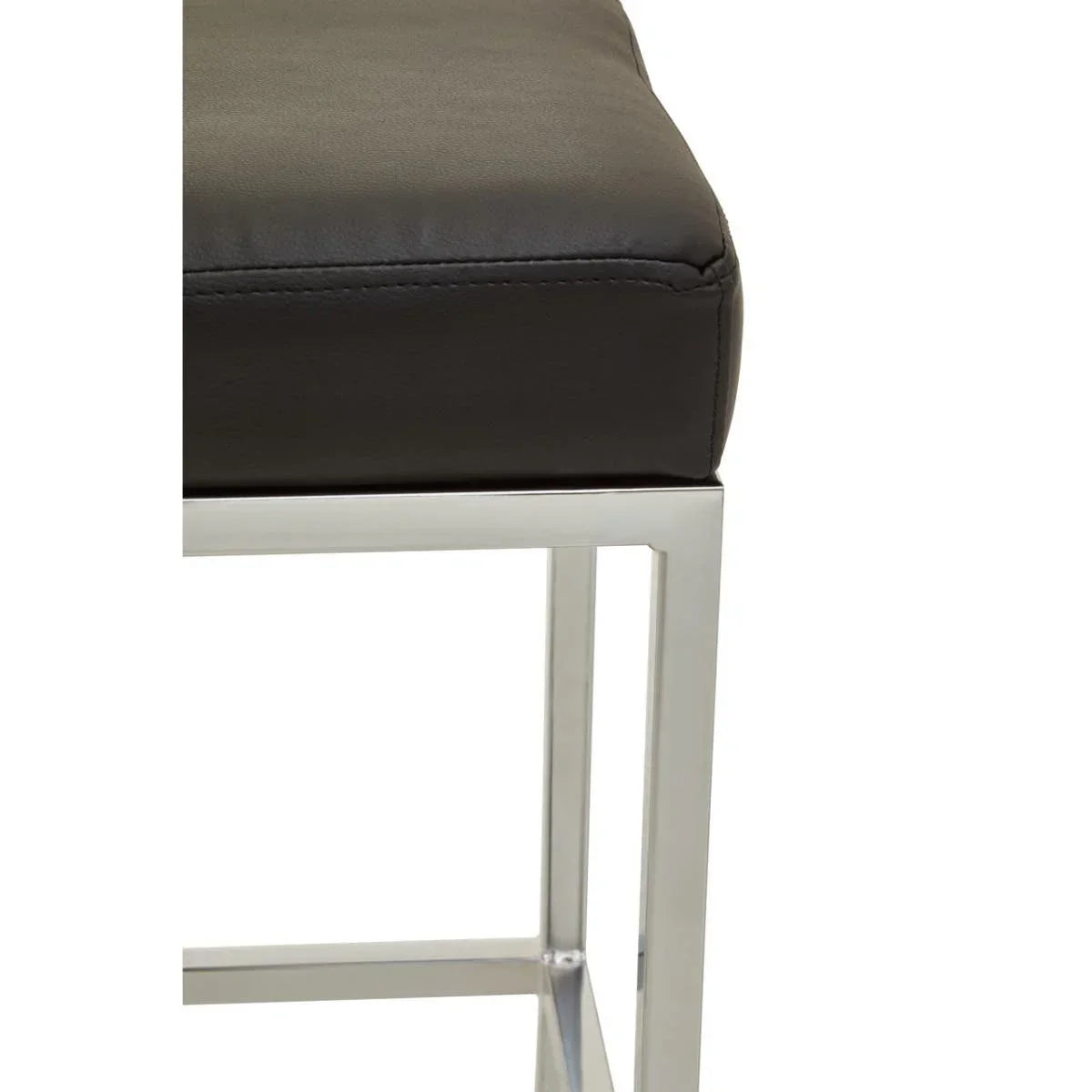 Black leather bar stool seat with chrome metal frame close-up